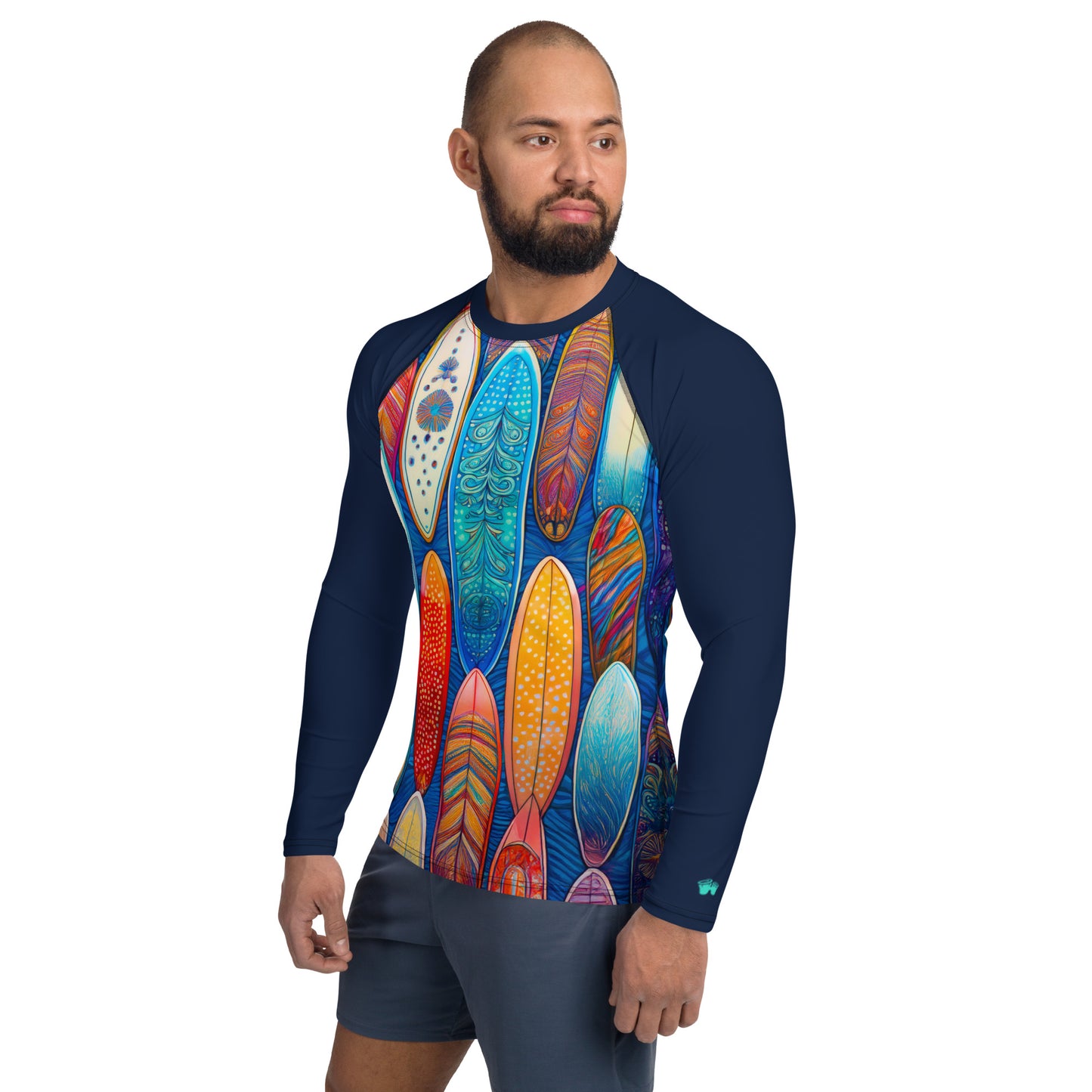 Man wearing a colorful surfboard-patterned rash guard, perfect for sun protection and stylish surf adventures.