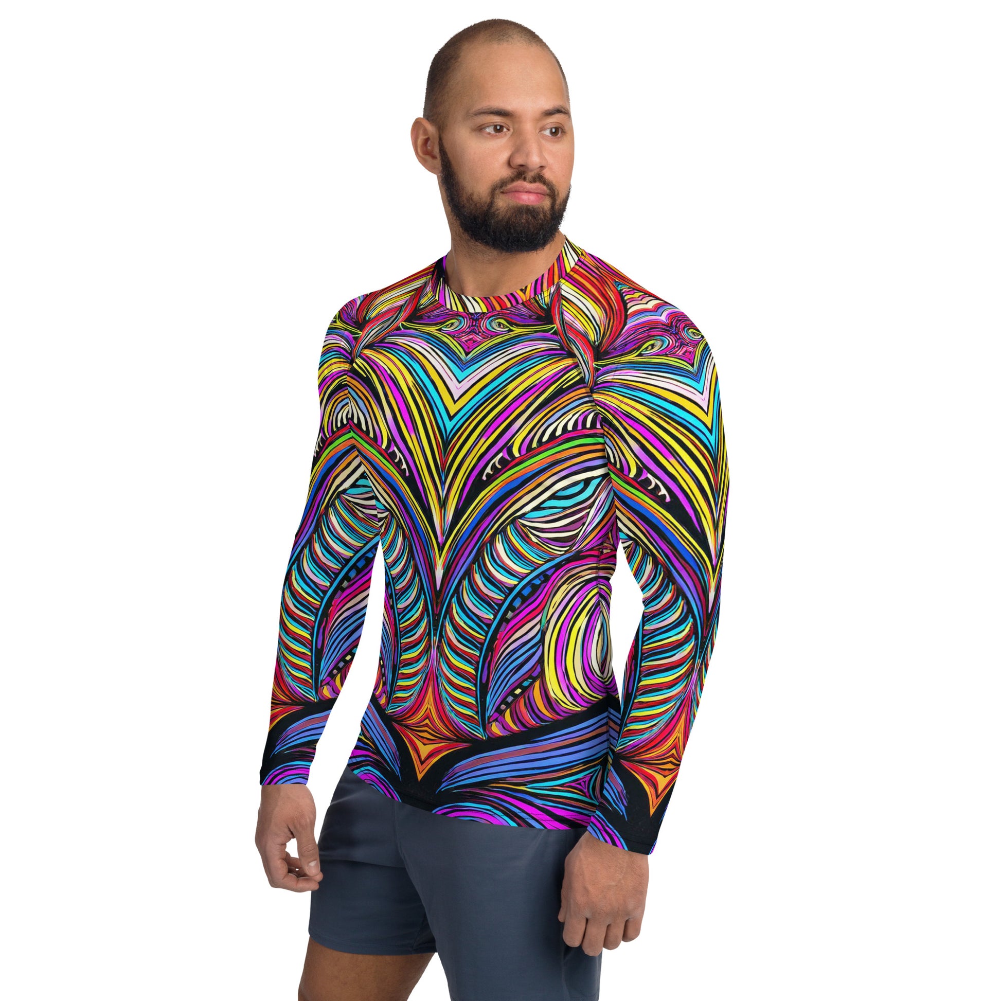 Man wearing colorful Mad Abstract Men's Rash Guard, showcasing vibrant tiki-inspired design and UPF 50+ protection.